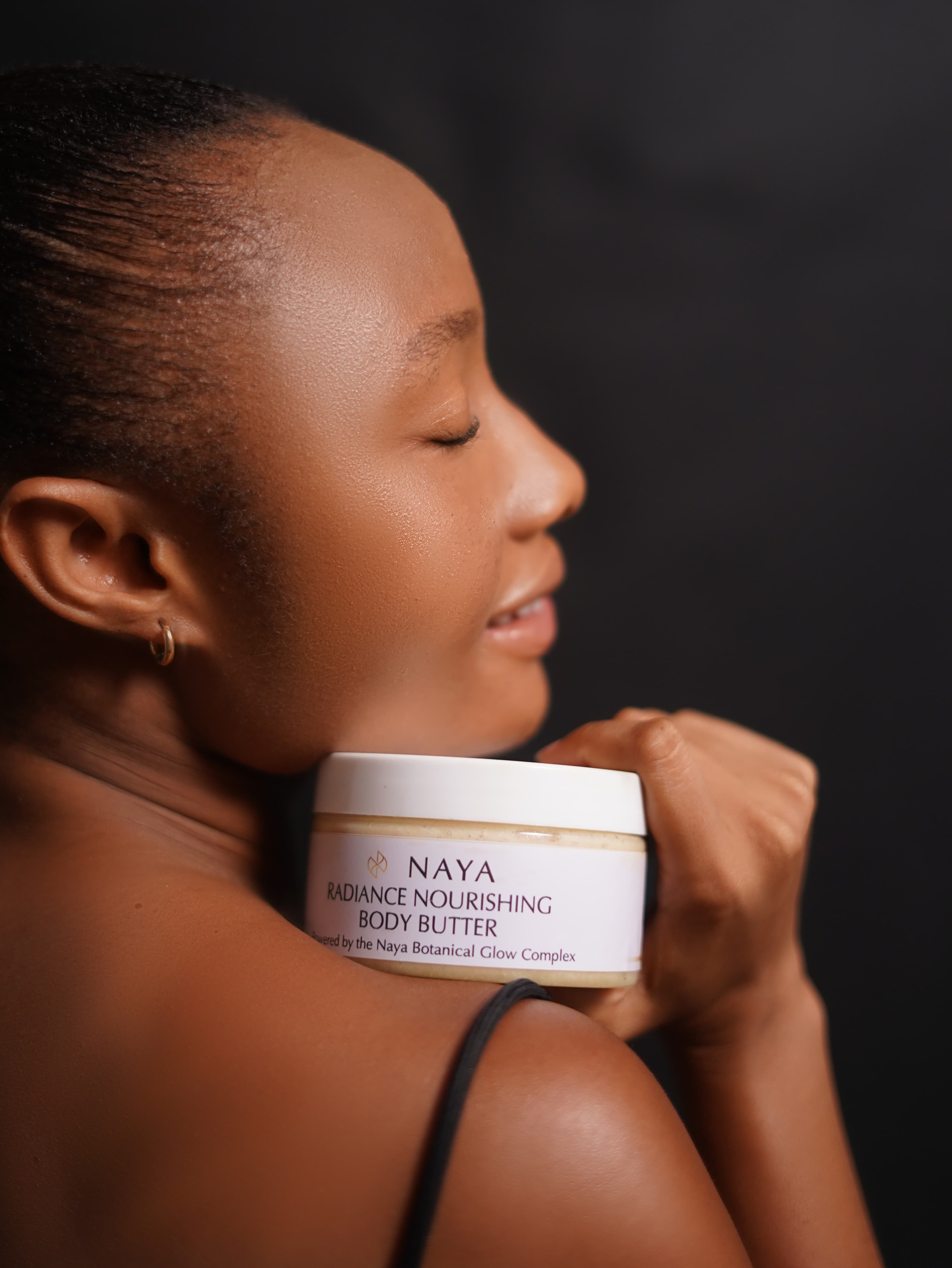 Naya Glows models holding Radiance Repair Lotion, Glow Body Oil, and Correcting Serum